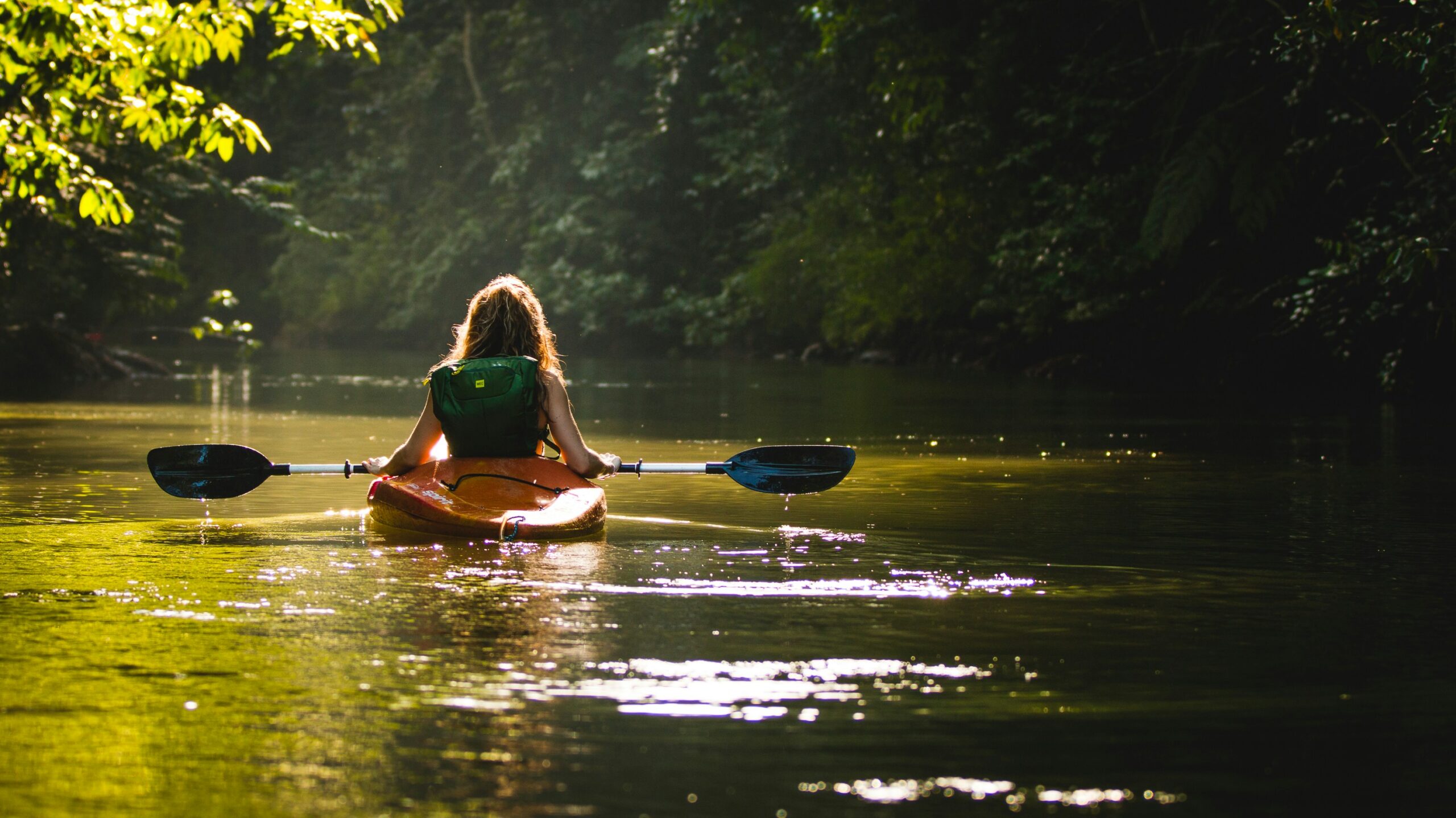 woman paddling on a kayak boat