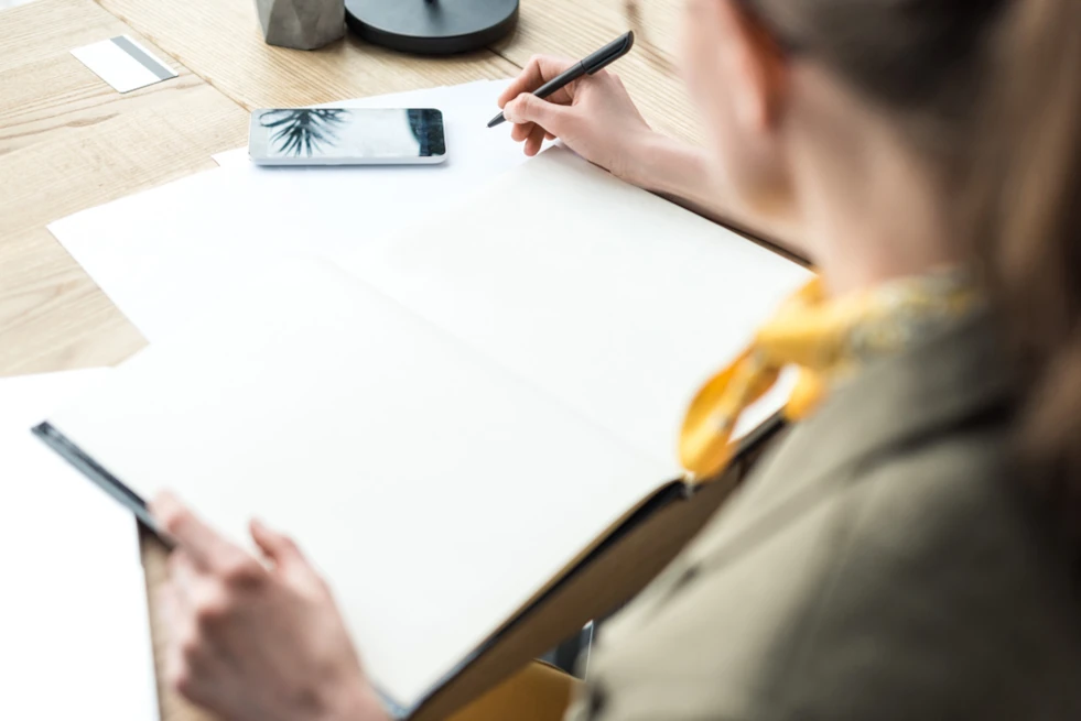 woman taking notes