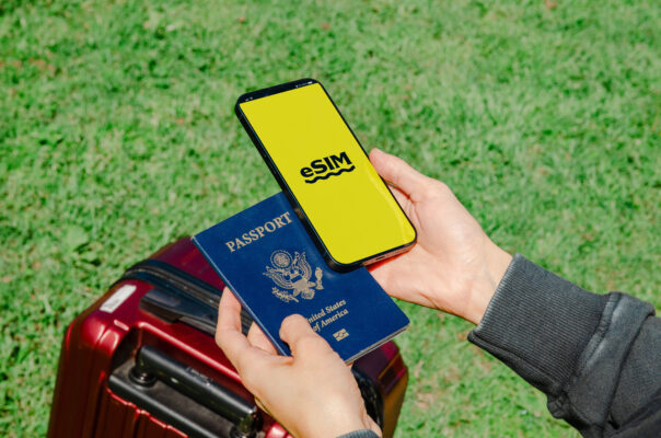 eSim, passport and suitcase
